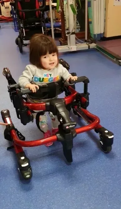 Jessica is using a gait trainer.